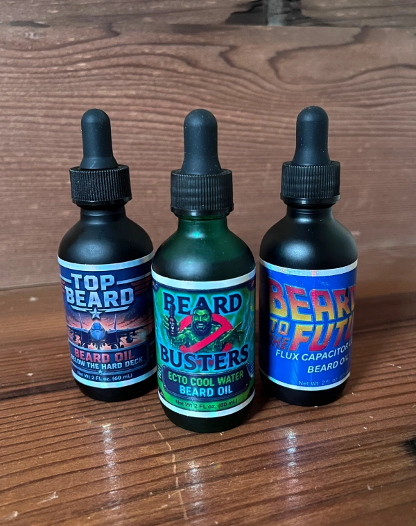 Three-bottle nostalgic beard oil combo featuring Top Beard, Beard Busters, and Beard to the Future